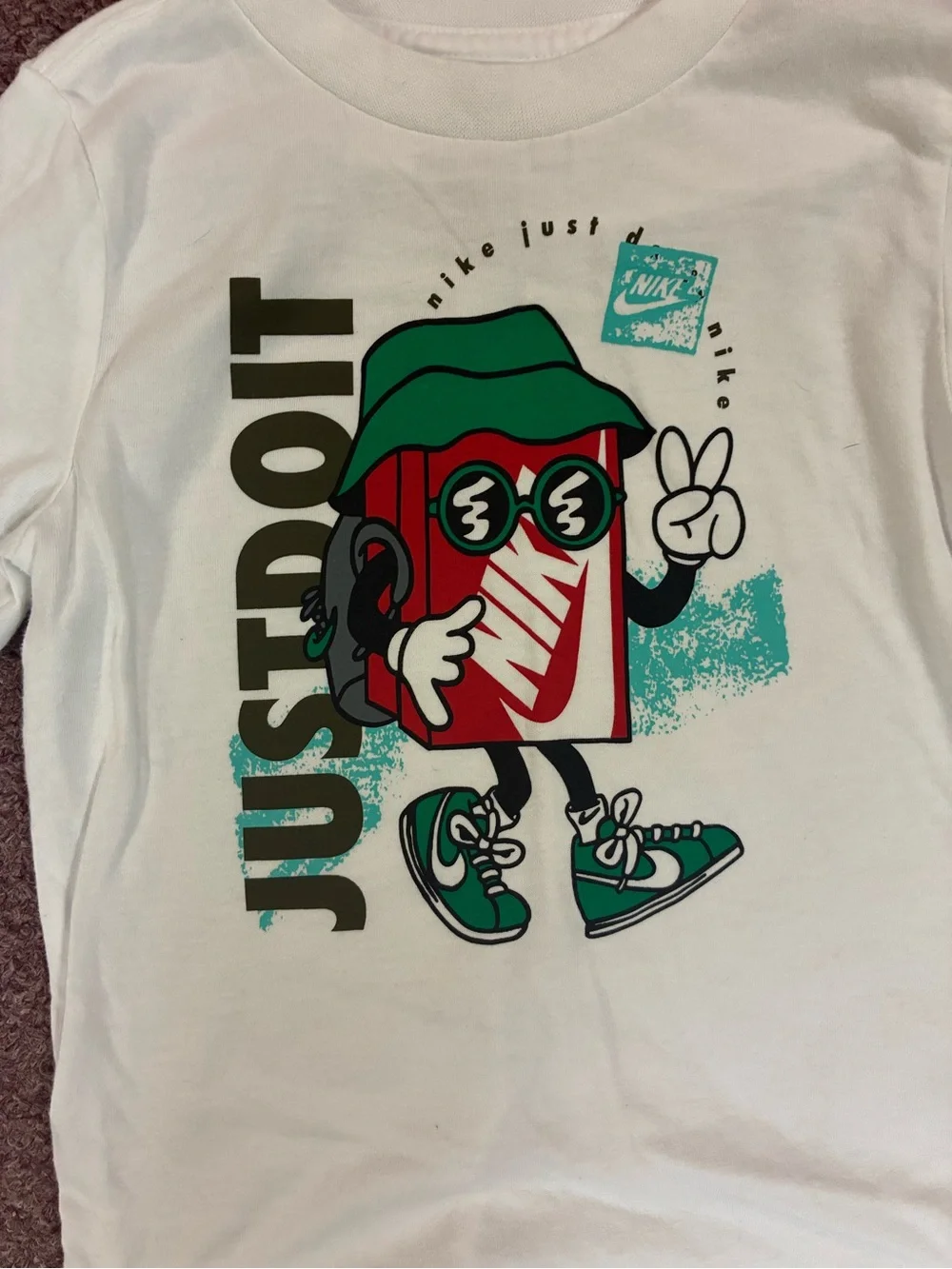 Nike White Long-Sleeve Tee with Colorful 'Just Do It' Character Graphic